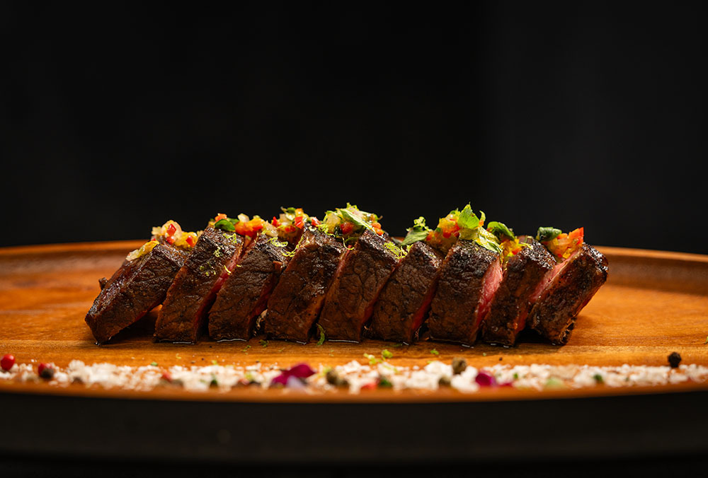 Prime New York strip, seared to perfection and crowned with a burst of Fresno flavor.